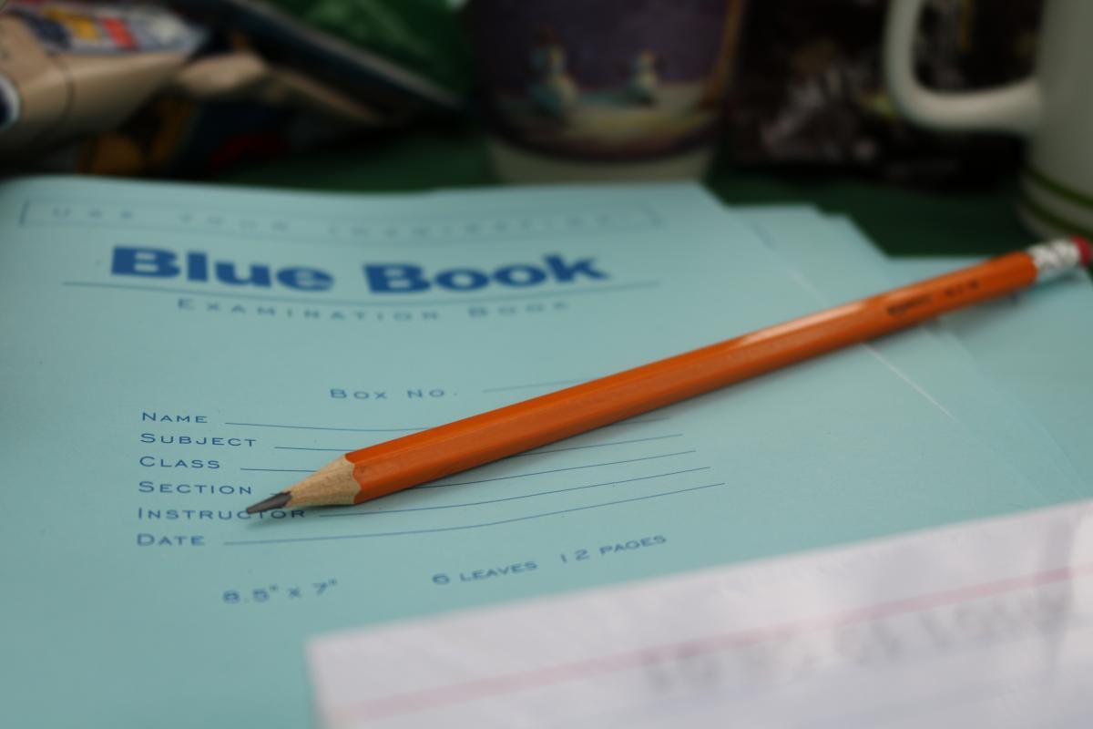 Blue Book and pencil