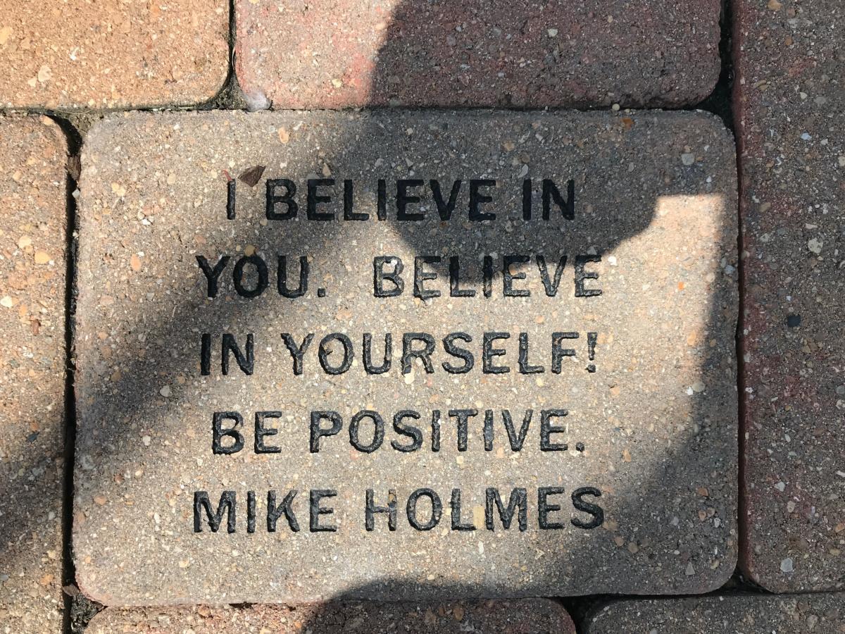 Brick with engraved quote.